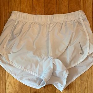 White Nike running shorts